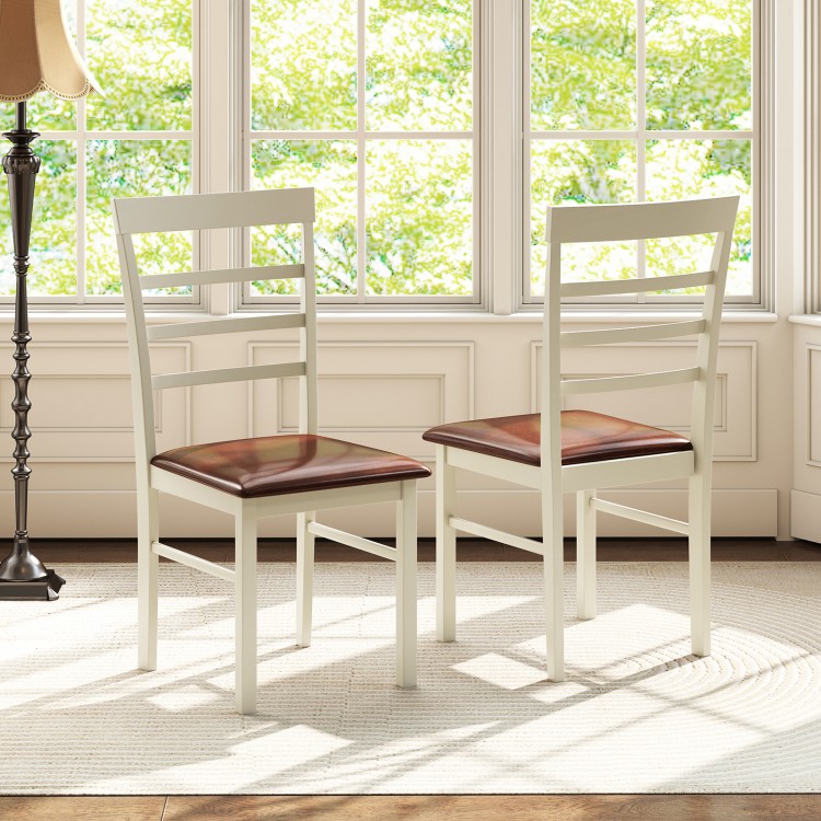 Two white PU leather upholstered dining chairs with curved backrests, perfect for home or restaurant use.