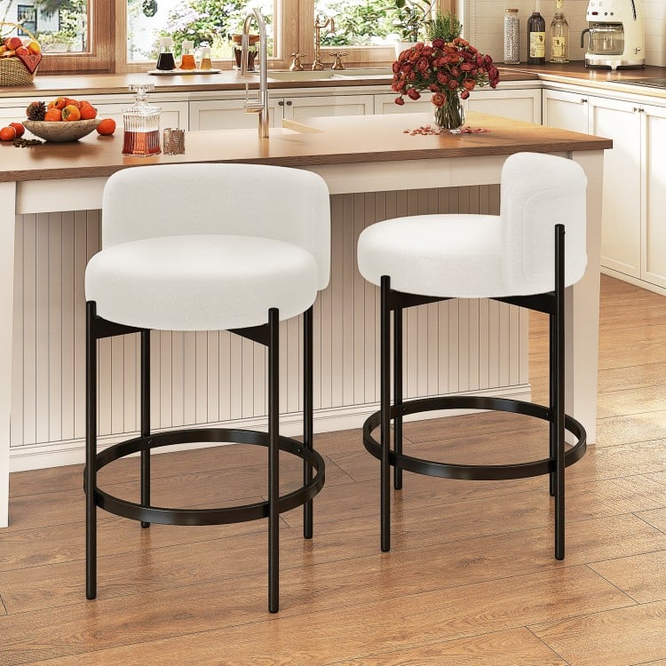 Set of 2 24-inch boucle counter stools with curved backrest, featuring a sturdy metal frame, perfect for kitchen or bar.
