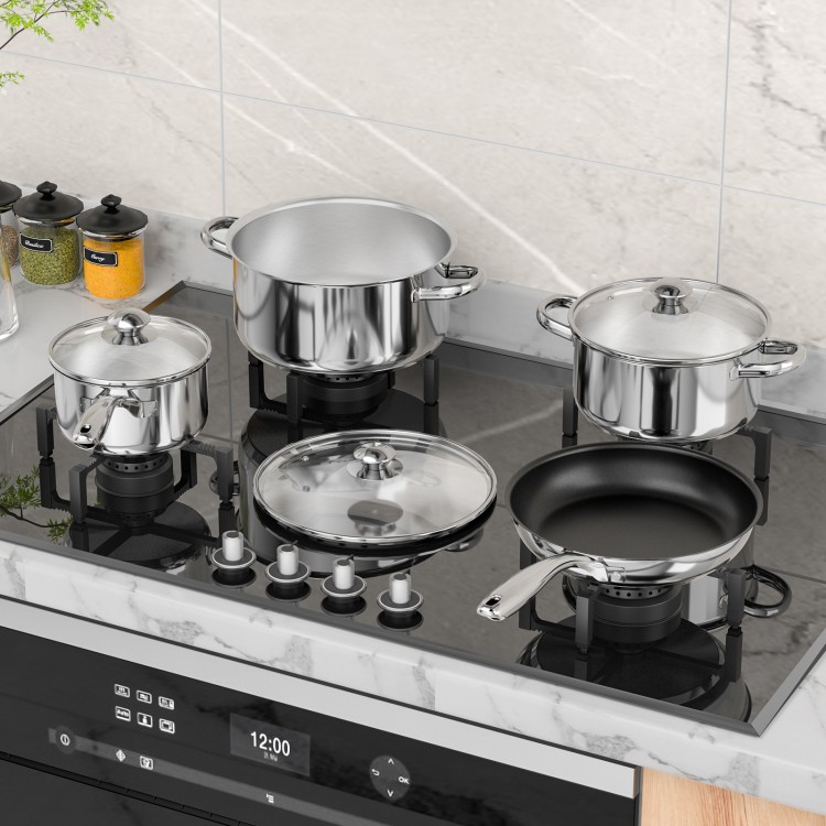 7-piece stainless steel cookware set on a stove, featuring pots and a non-stick fry pan with tempered glass lids.
