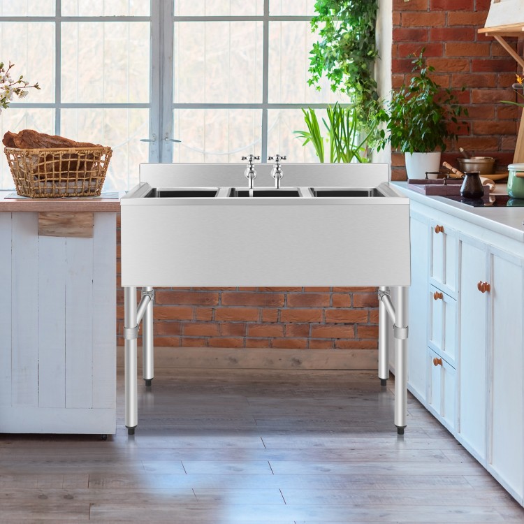 Stainless steel utility sink with three compartments, adjustable legs, and high backsplash, ideal for commercial.