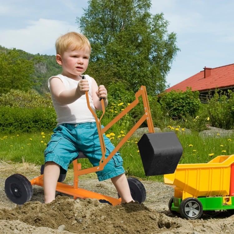 Child operating a heavy-duty ride-on sand digger excavator with a sturdy steel frame in a garden setting.