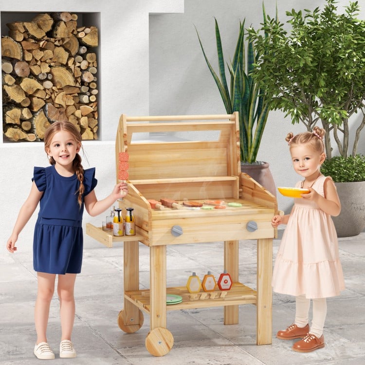 Kids wooden barbecue grill playset with food and wheels, perfect for pretend play in backyards or playrooms.