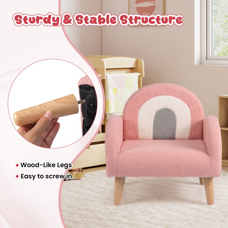 Kids armchair in pink with comfy backrest, armrests, and wood-like legs, perfect for home or kindergarten use.