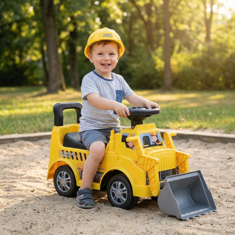 Kids digger ride-on truck in yellow with shovel, under-seat compartment, and adjustable steering wheel for outdoor fun.