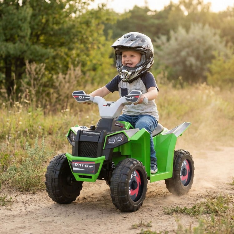 Kids electric ATV quad car in green with detachable trailer, perfect for outdoor fun and promoting motor skills.