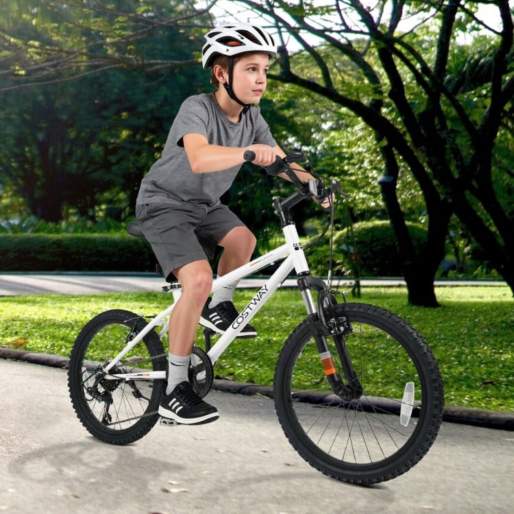 Child riding a white 20-inch mountain bike with adjustable saddle, dual V-brakes, and large pneumatic tires for smooth.