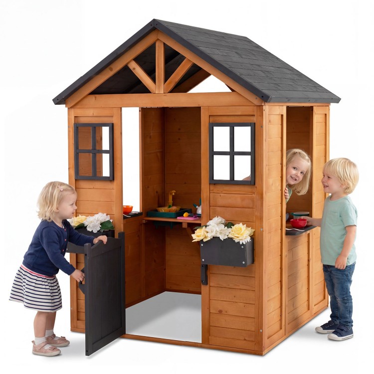 Kids outdoor playhouse with sink, crafted from spruce wood, featuring a half door and flower pots for imaginative play.