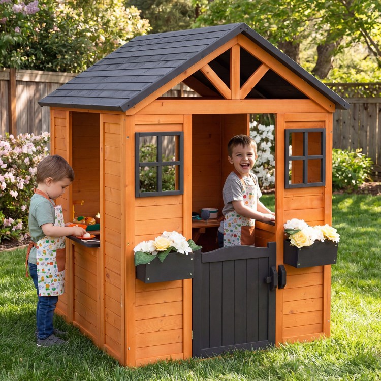 Kids outdoor playhouse with sink, wooden cottage design, featuring a half door and flower pots for imaginative play.