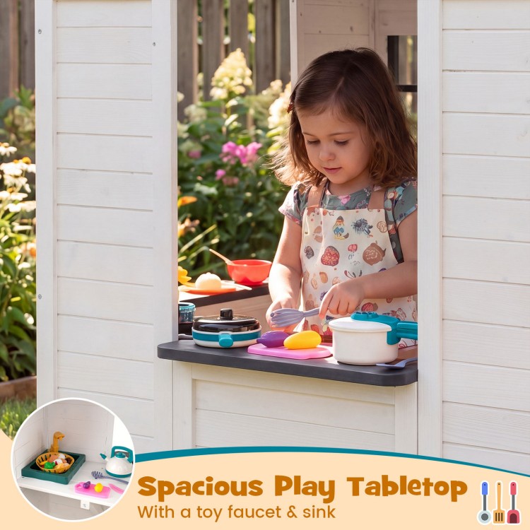 Spacious play tabletop with toy faucet and sink in a kids' outdoor playhouse, perfect for pretend cooking fun.