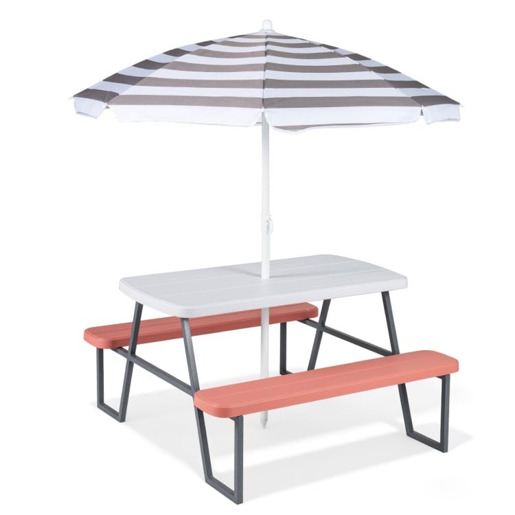 Kids picnic table with pink benches and a foldable striped umbrella, perfect for indoor or outdoor fun and activities.
