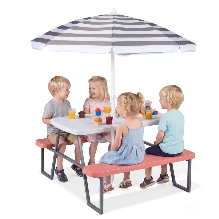Kids picnic table with pink benches and a foldable umbrella, perfect for outdoor play and crafts for up to four.