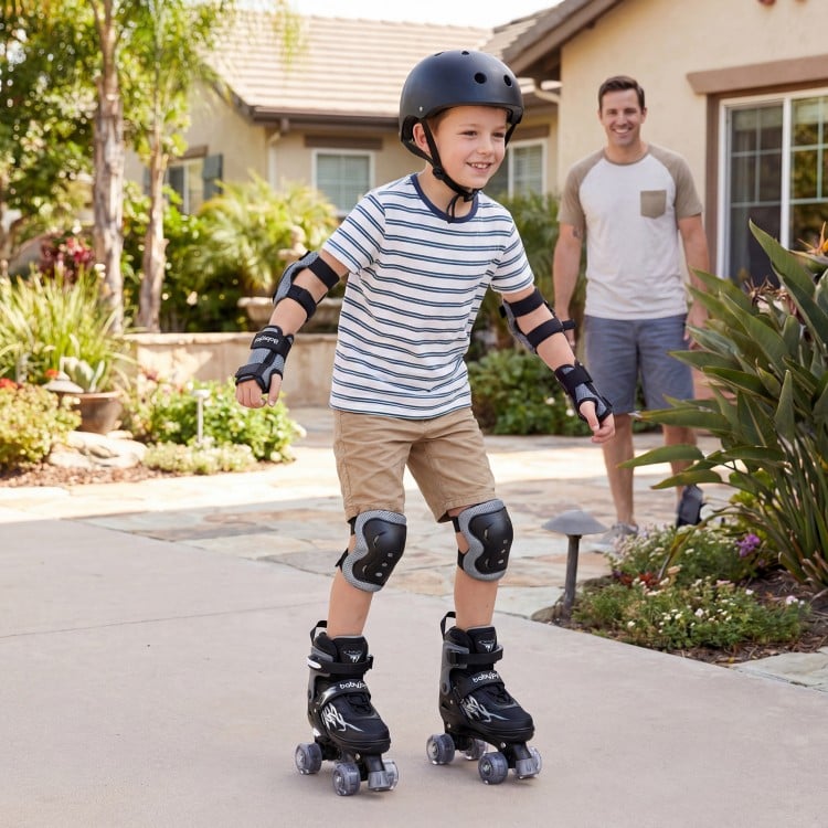Kids roller skates in black with light-up wheels, adjustable sizes, and safety gear for outdoor fun and balance.
