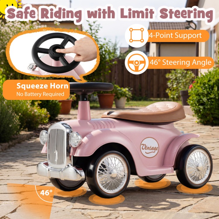 Kids sit-to-stand vehicle in pink with working steering wheel, under-seat storage, and vintage car design for fun rides.