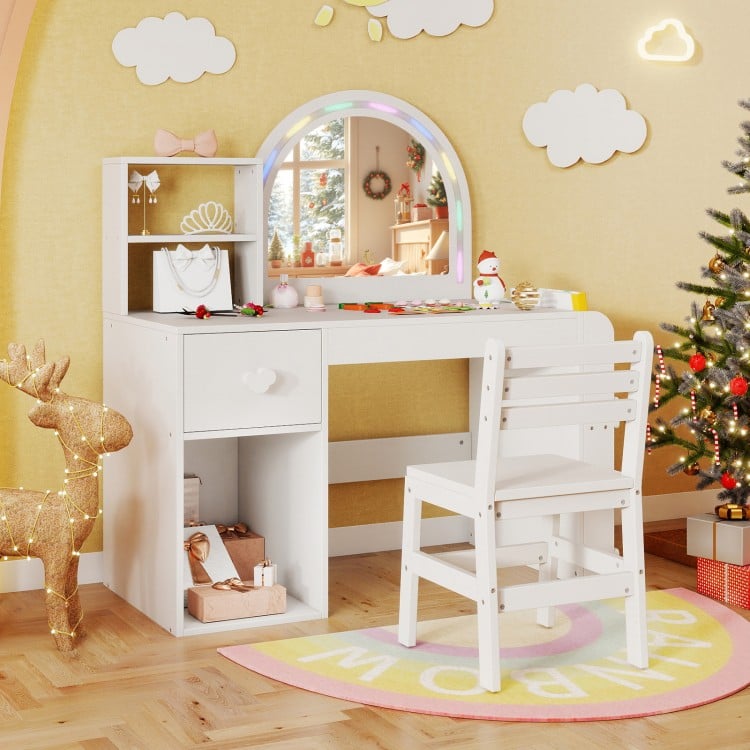 Kids vanity table and chair set in white with lighted mirror, open shelf, and drawer for organized storage in a playful.