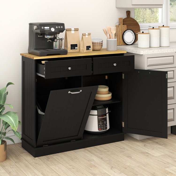 Kitchen tilt-out trash cabinet in black with two drawers, adjustable shelf, and wide countertop for versatile storage.