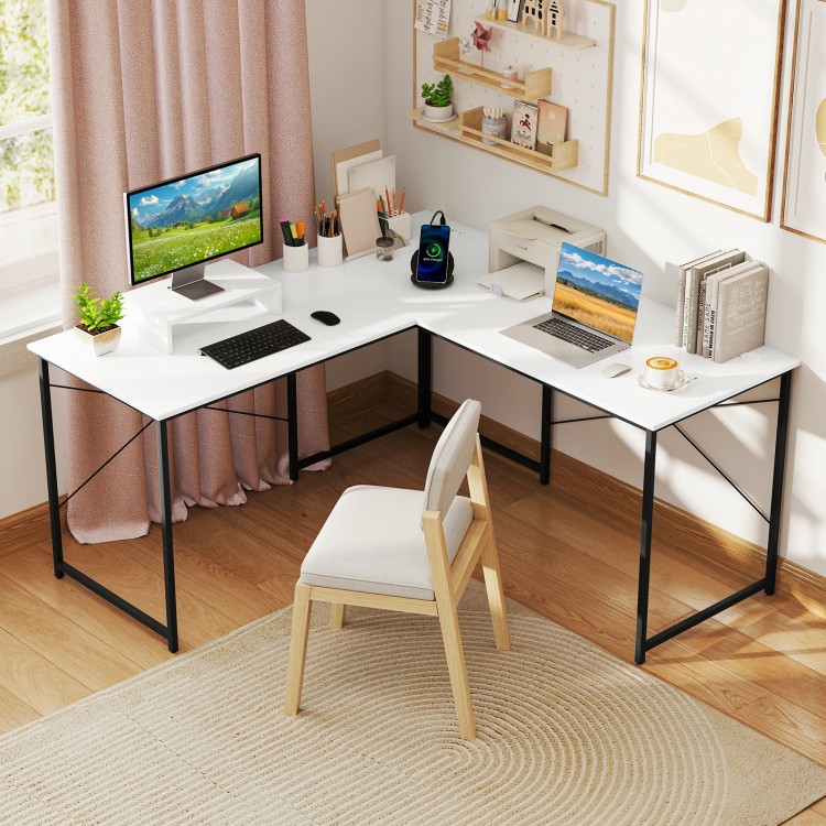 L-shaped corner desk in white featuring a movable monitor shelf and built-in power outlets for convenient charging.