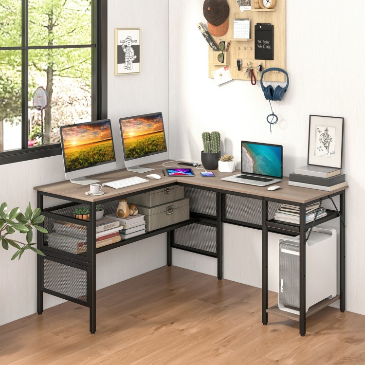 Corner view of L-shaped computer desk in gray, highlighting mesh shelves and large desktop for efficient office.