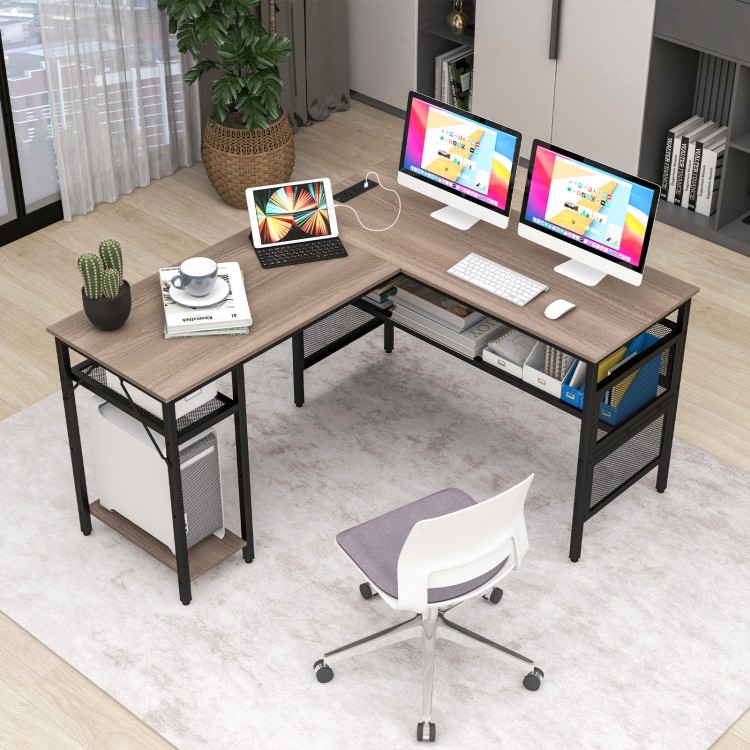 Top view of L-shaped computer desk in gray with charging station, large workspace, and organized mesh shelves for.