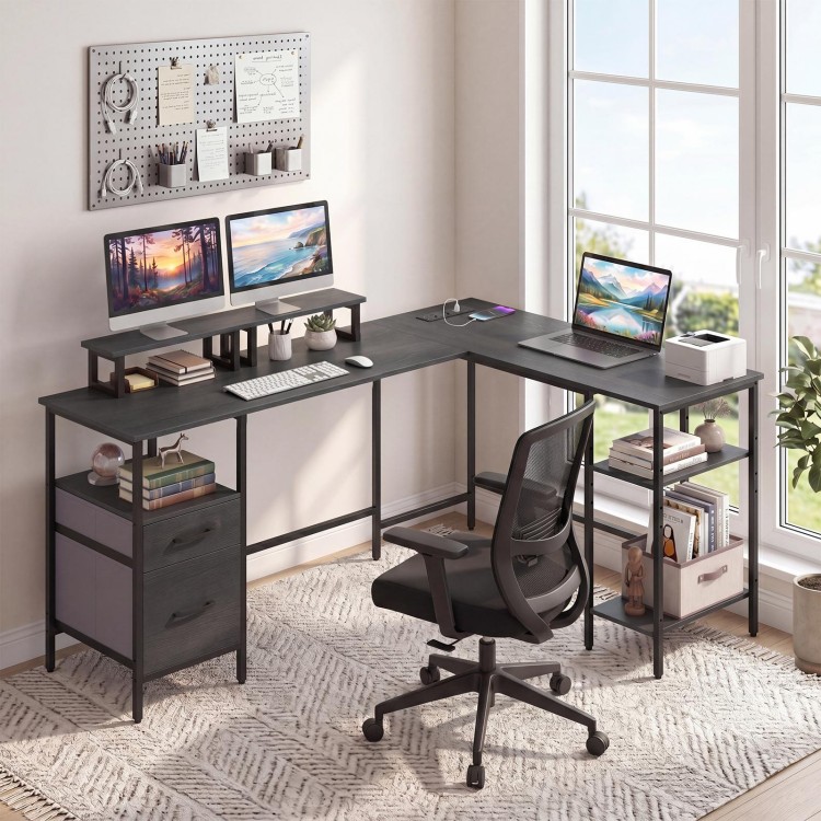 L-shaped black desk with monitor stands, open shelves, and built-in power outlet for versatile office use.