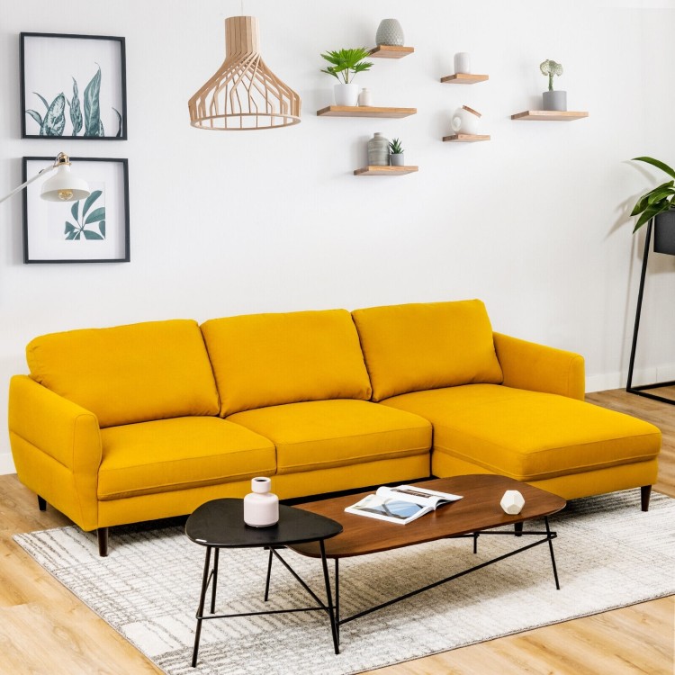 L-shaped yellow fabric sectional sofa with chaise lounge, solid wood legs, perfect for cozy living room relaxation.