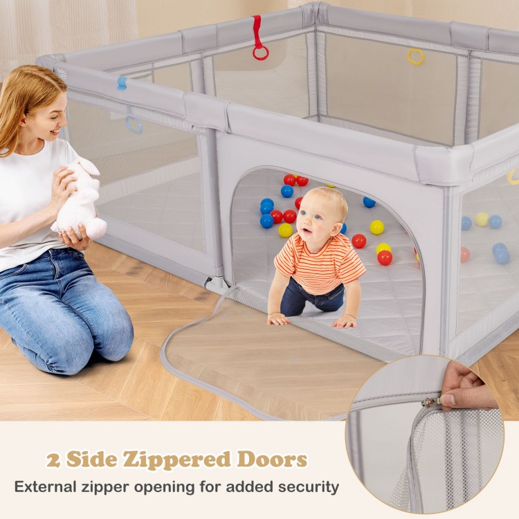 Large baby playpen in gray with two side zippered doors and colorful ocean balls for safe, active play.