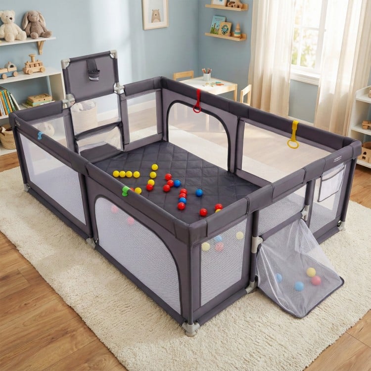 Large dark gray baby playpen with mat, ocean balls, pull rings, and zippered doors for safe play and easy storage.