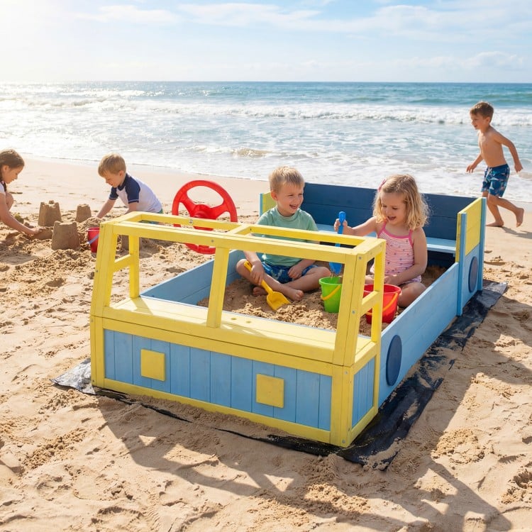 Large car-theme sandbox in blue with fir wood frame, designed for imaginative play and storage of sand toys at the.