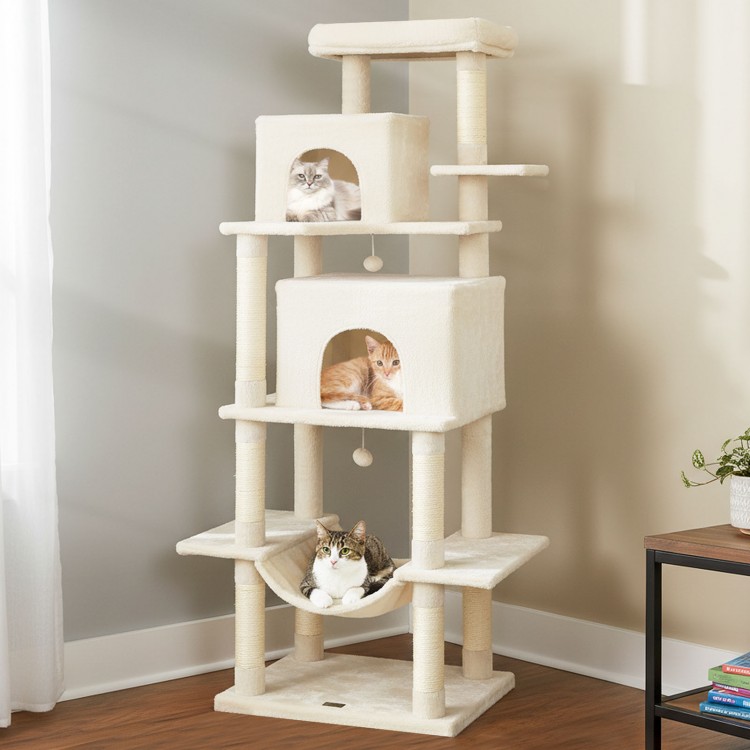 Large beige cat tree with multi-level platforms, condos, and hammock for indoor cats, promoting exercise and play.