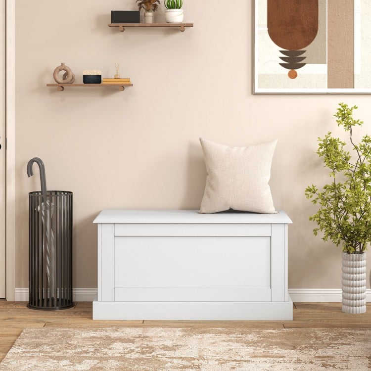 Large off-white storage chest with safety metal hinge, ideal for organizing books and clothes in a clutter-free space.
