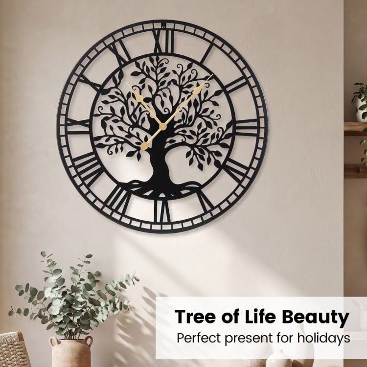 Large 27-inch black metal wall clock featuring a tree of life design, perfect for holiday gifting and home decoration.