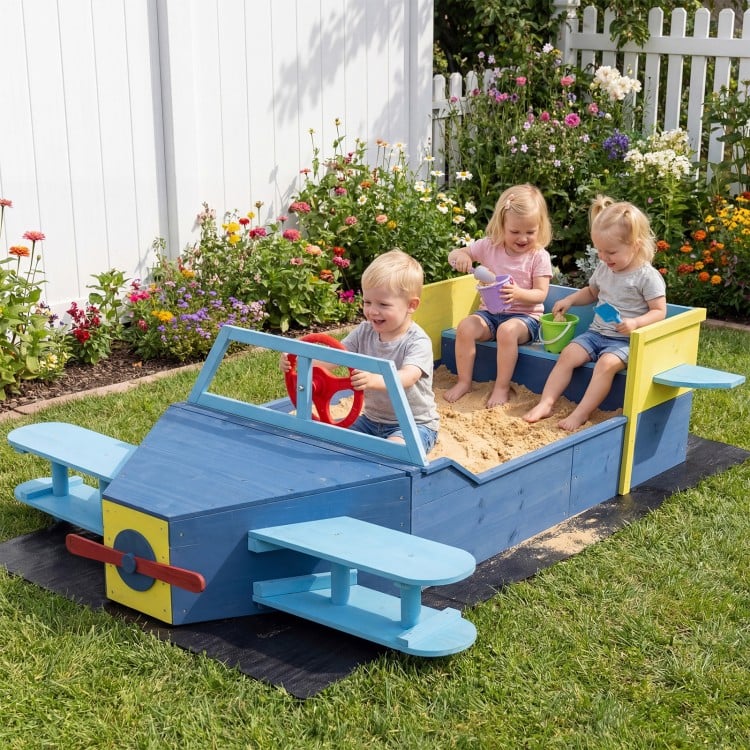 Large blue wooden kids sandbox shaped like an airplane, featuring a spacious seat and colorful propeller for.