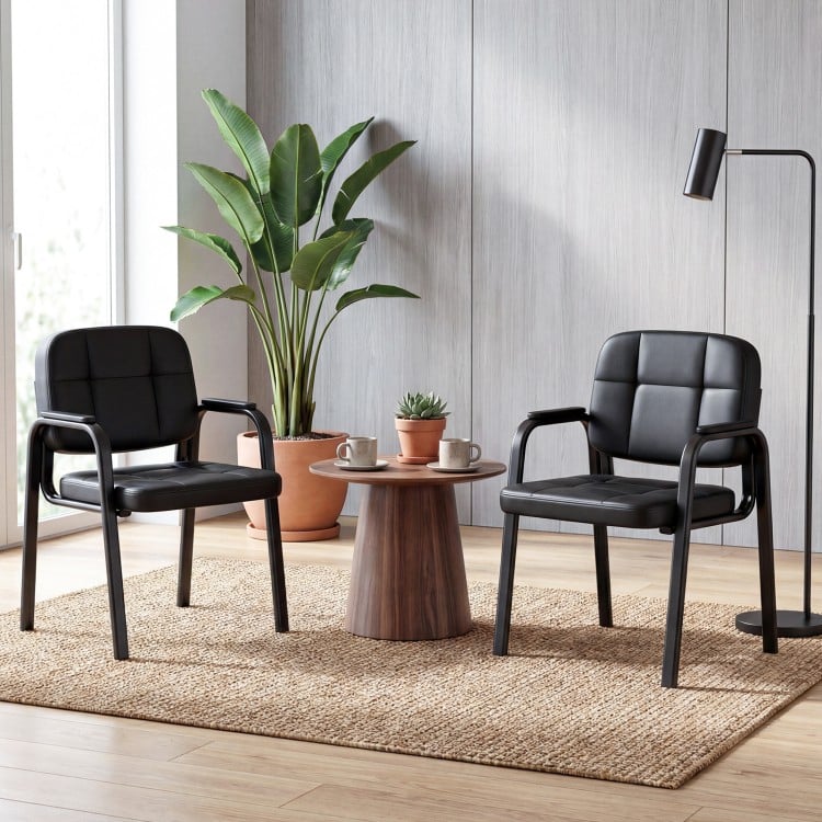 Set of 2 leather office reception chairs with cushioned seats and ergonomic backrests, perfect for waiting rooms.