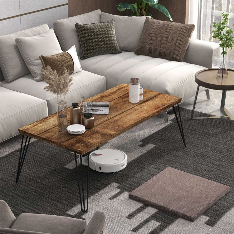 Wooden rectangular coffee table with metal legs, showcasing a rustic wood surface, perfect for modern living room décor.