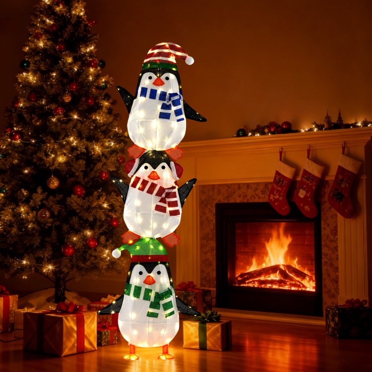 Lighted penguin decoration with warm white lights, cute hats, and scarves, perfect for festive indoor or outdoor.