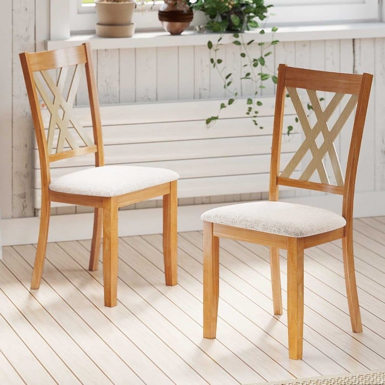 Natural wooden dining chairs with linen fabric upholstery, featuring an X-shaped backrest for comfort and ventilation.