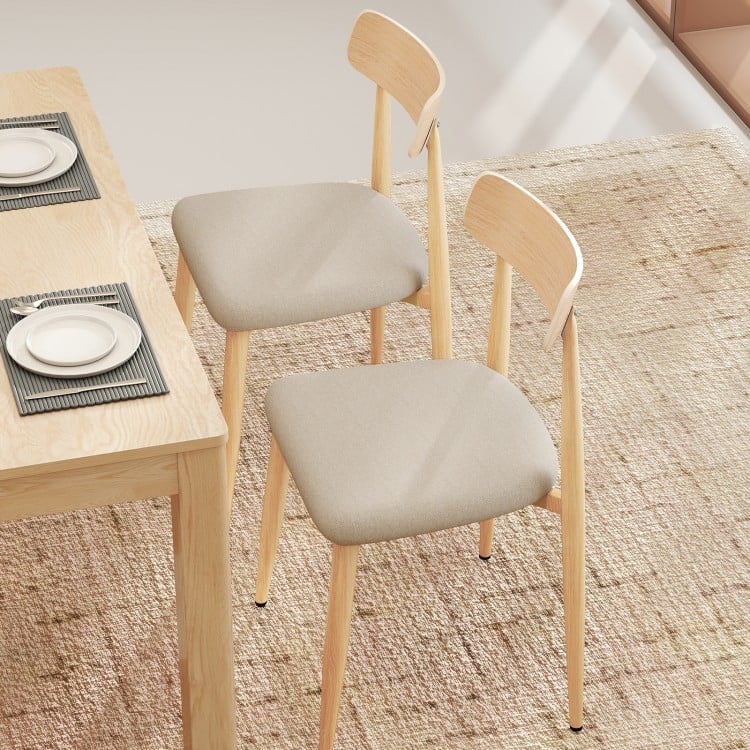 Set of 2 modern dining chairs with padded linen fabric seats and curved backs, featuring oak-like metal legs for.
