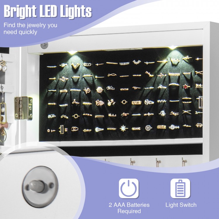 Close-up view of the lockable jewelry cabinet's LED lights illuminating organized rings and necklaces for easy.