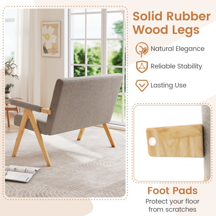 Gray loveseat sofa with armrests and rubber wood legs, featuring a slanted backrest for comfort in small spaces.
