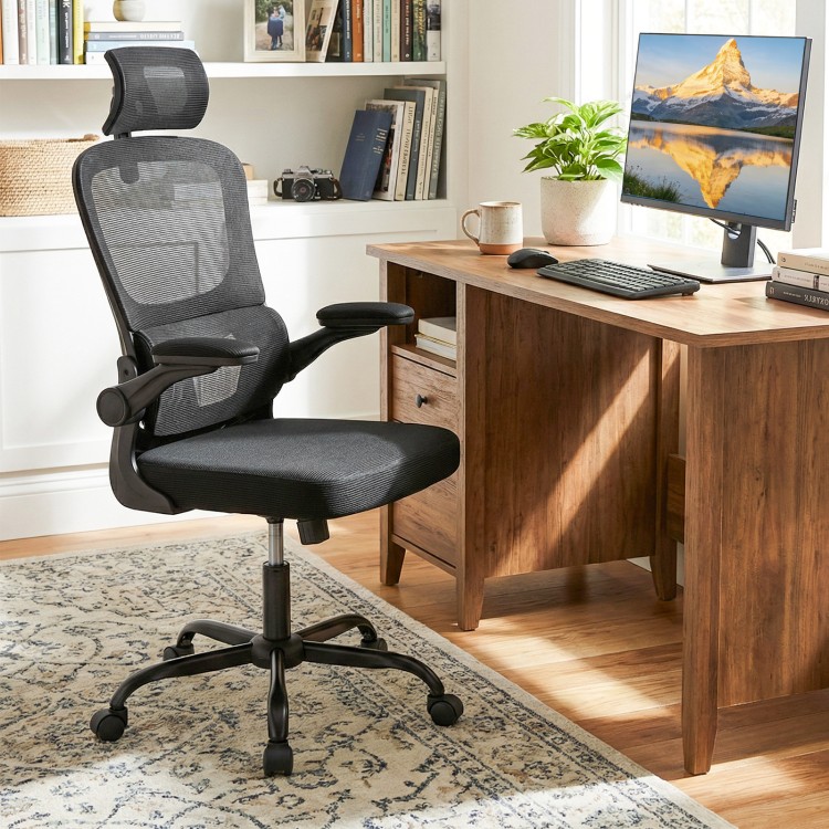 Black mesh office chair with adaptive lumbar support, flip-up armrests, and reclining backrest for ergonomic comfort.