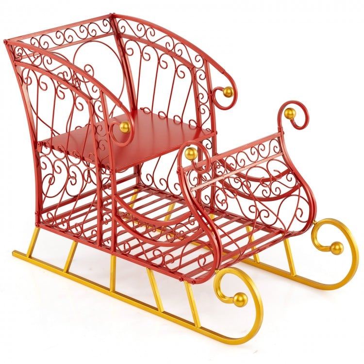 Red metal Christmas Santa sleigh basket with a golden base, featuring two tiers for festive gift storage and decoration.