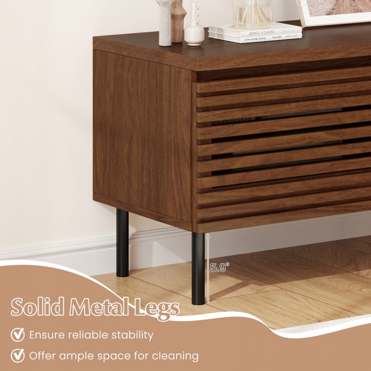 Close-up of the walnut fluted TV stand showcasing solid metal legs, designed for stability and easy cleaning.