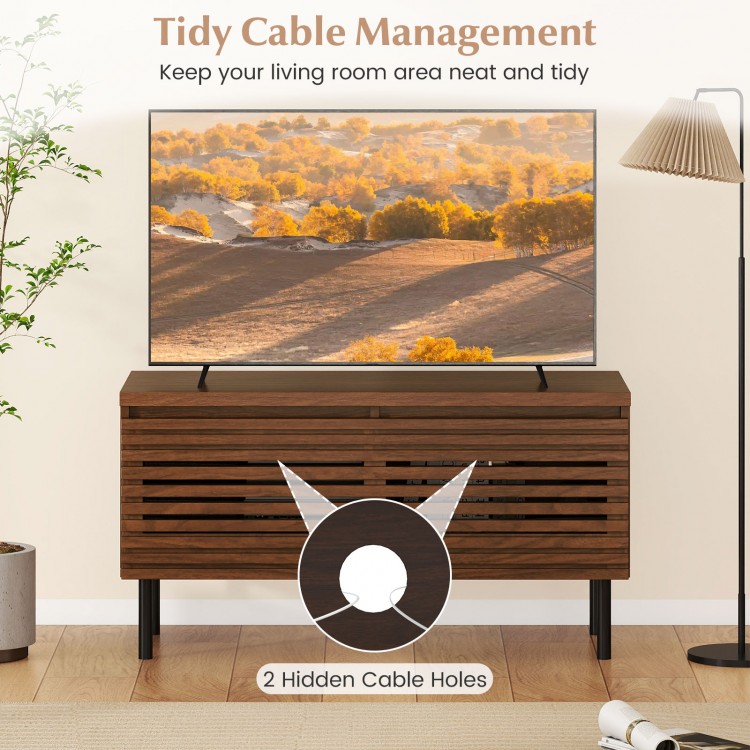 Mid Century fluted TV stand in walnut with 2 hidden cable holes, perfect for organizing electronics and enhancing decor.