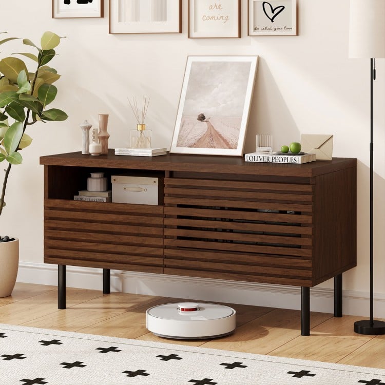 Mid Century fluted TV stand in walnut with open compartment and drawer, perfect for modern entertainment setups.