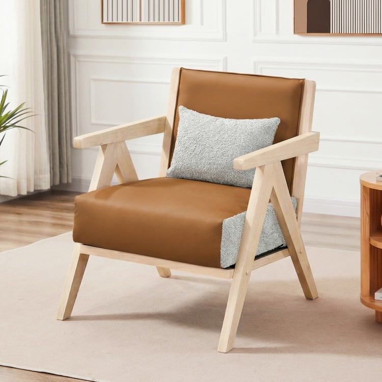 Mid-century modern accent chair with brown artificial leather and rubber wood frame, featuring a removable gray throw.