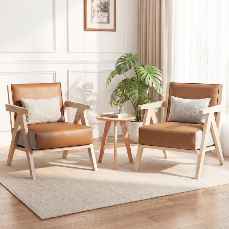 Mid-century modern accent chairs in brown artificial leather with rubber wood frame, ideal for living room or office.