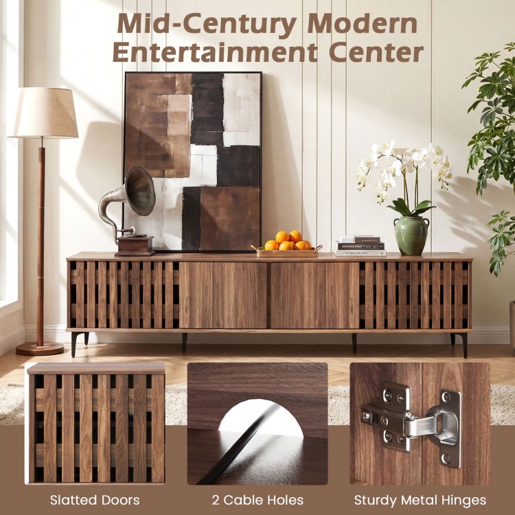 Mid-century modern entertainment center in walnut with slatted doors, 4 storage cabinets, and cable management holes.