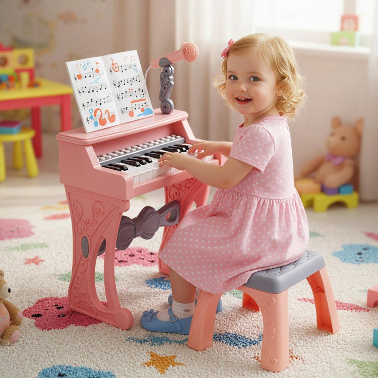 Mini keyboard piano for kids in pink with 25 keys, microphone, and matching stool, perfect for toddlers' music play.