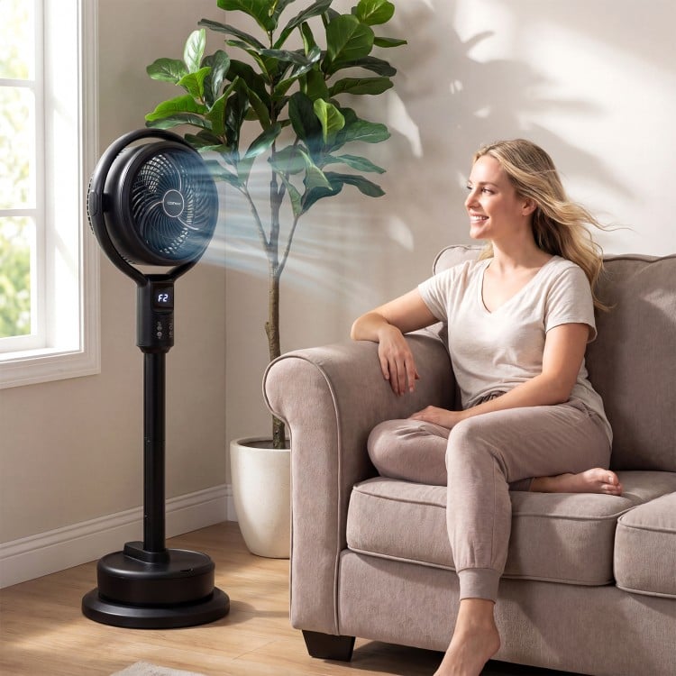 Misting pedestal fan with 90° oscillation and 8 speeds, providing cool airflow and mist for summer comfort indoors.