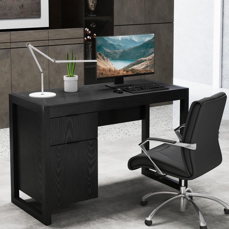 Modern black computer desk with spacious tabletop, large drawer, and cabinet for efficient workspace organization.