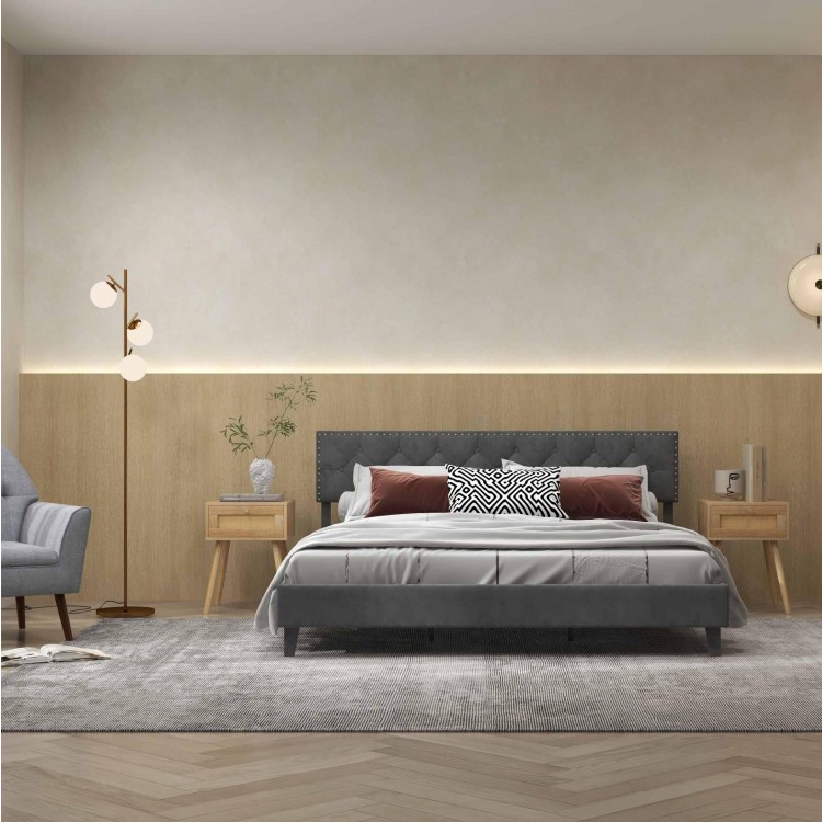 Upholstered queen bed with rattan nightstands and a 3-globe floor lamp, perfect for a stylish bedroom retreat.